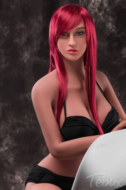 redhead Real Life Sex Doll in black lingerie sitting on a white chair