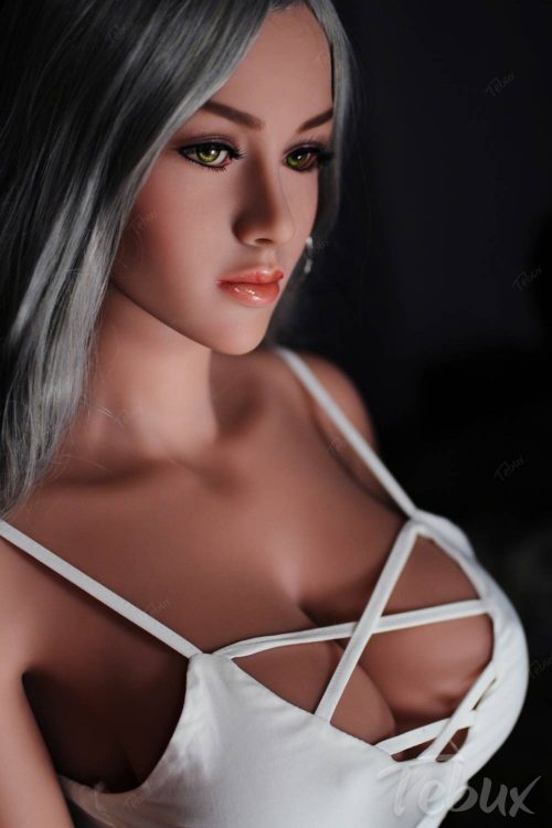 Life-like sex doll wearing white dress