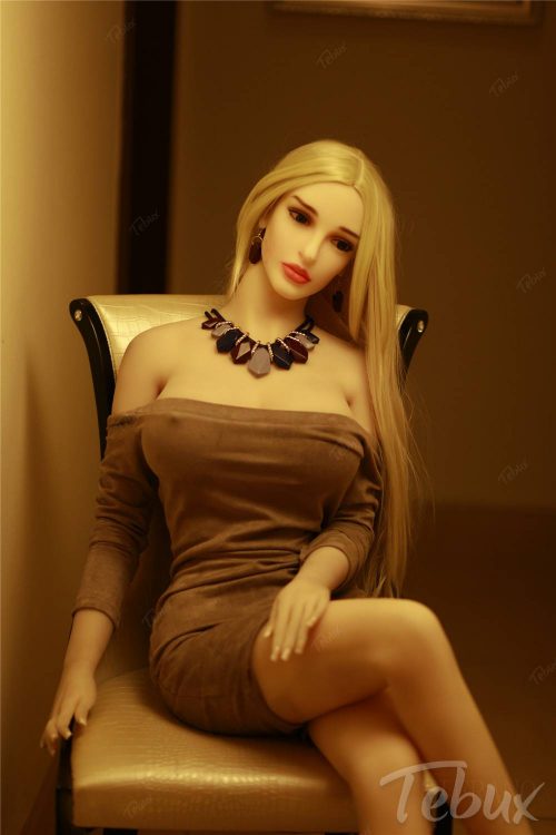 Blonde mature sex doll in brown dress with necklace