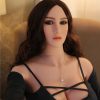 Curvy Sex Dolls brunette showing cleavage through black shirt